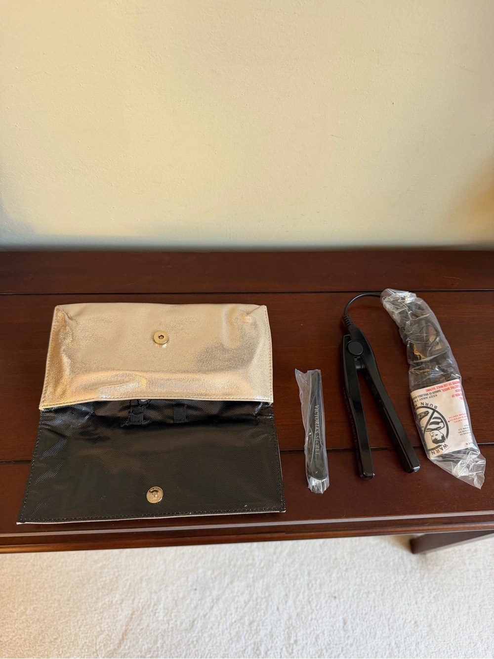 Victoria's Secret travel mini flat iron in beautiful gold metallic case. NWT